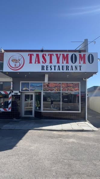 Tasty Momo restaurant shopfront sign